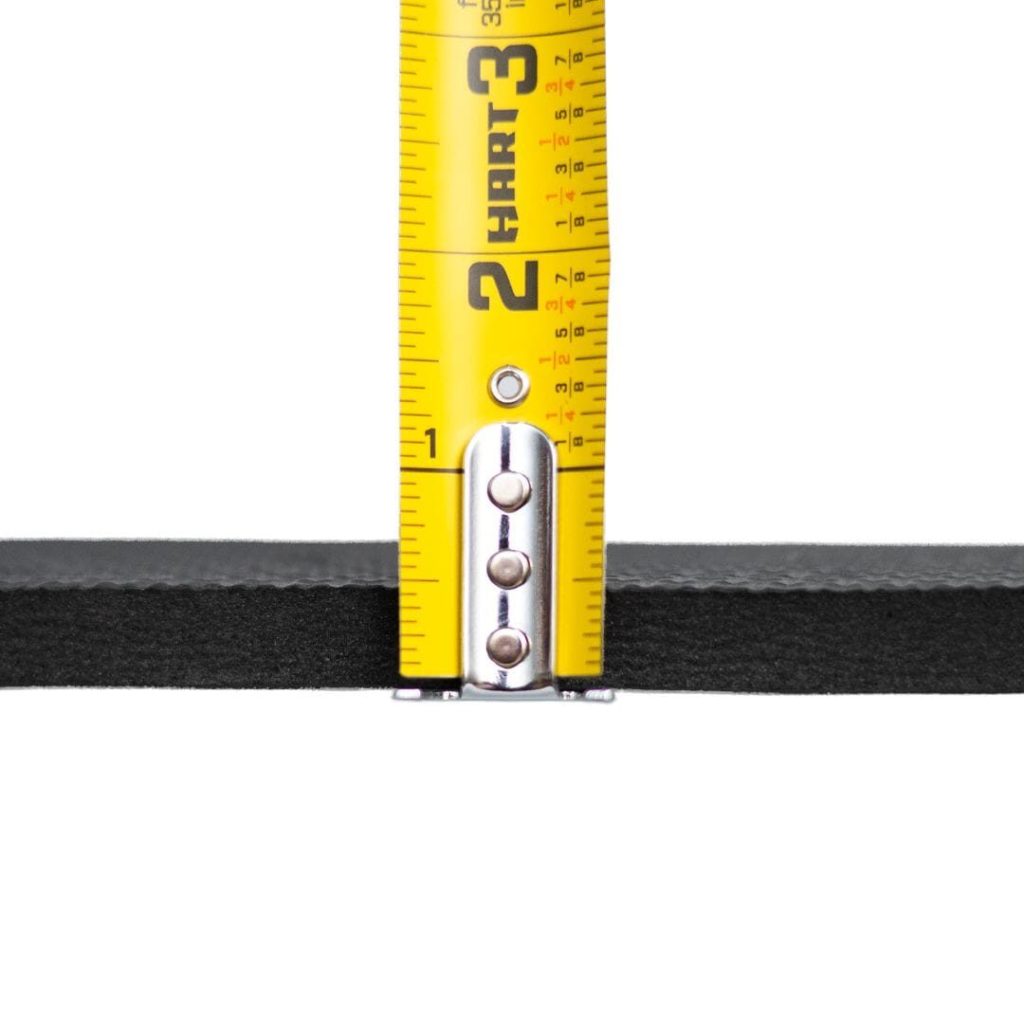 Golf Simulator Flooring (2026): What Goes Under and Around the Mat 2 A tape measure against the edge of a foam floor tile