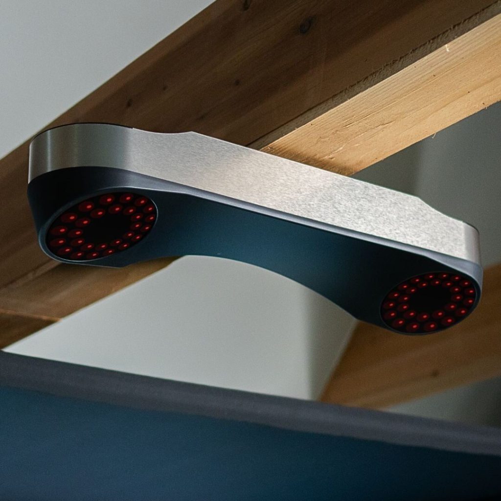 ProTee VX launch monitor mounted overhead under a ceiling beam