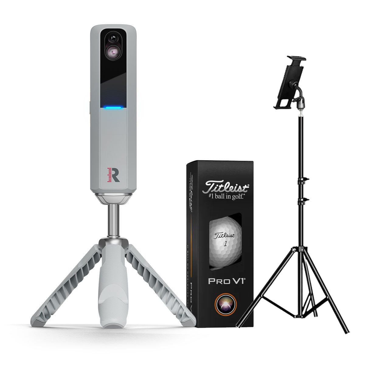 Rapsodo MLM2PRO on its tripod beside a sleeve of Titleist RPT balls